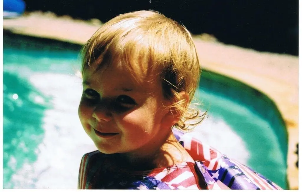 A Young Evan Posing For A Picture in a Color Image