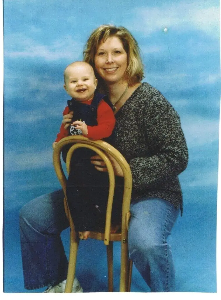 Suzanne Posing on A Chair With Ian Color Image for Website