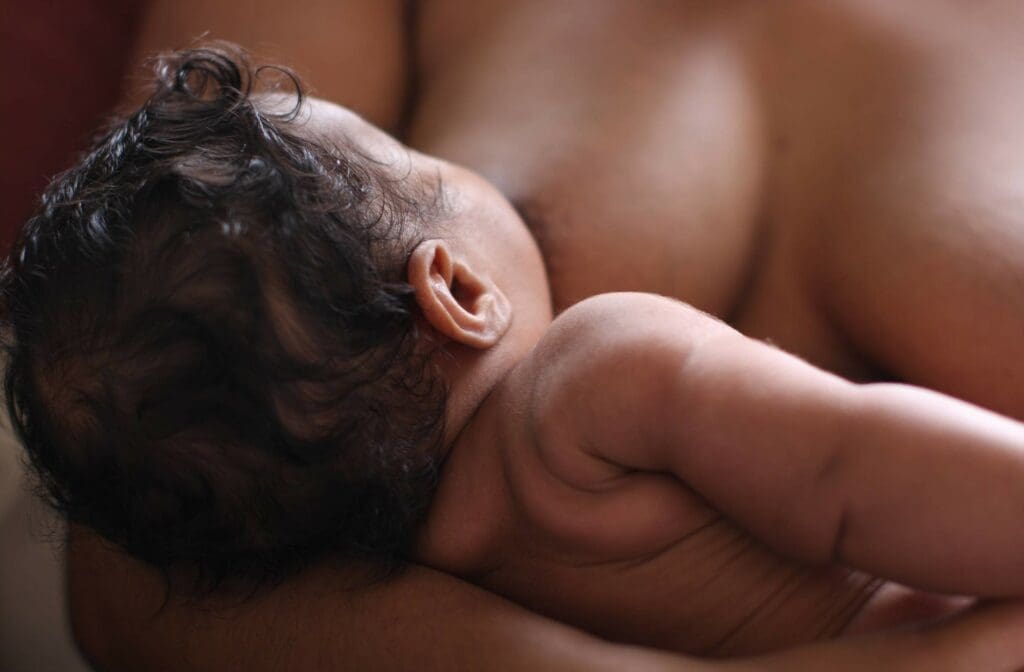 mother breastfeeding black breastfeeding week