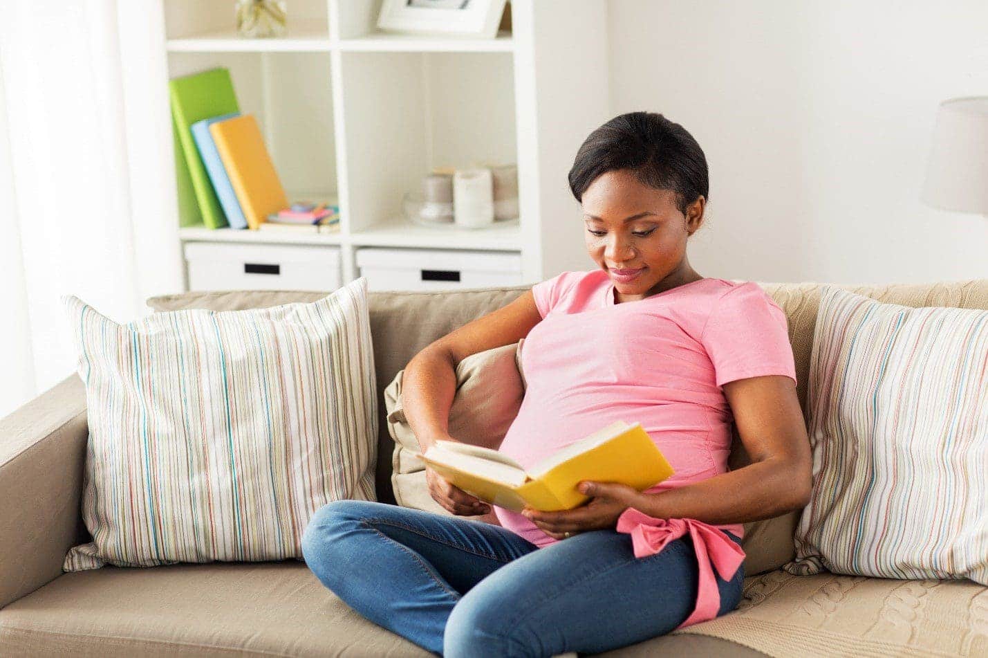 mother reading breastfeeding book