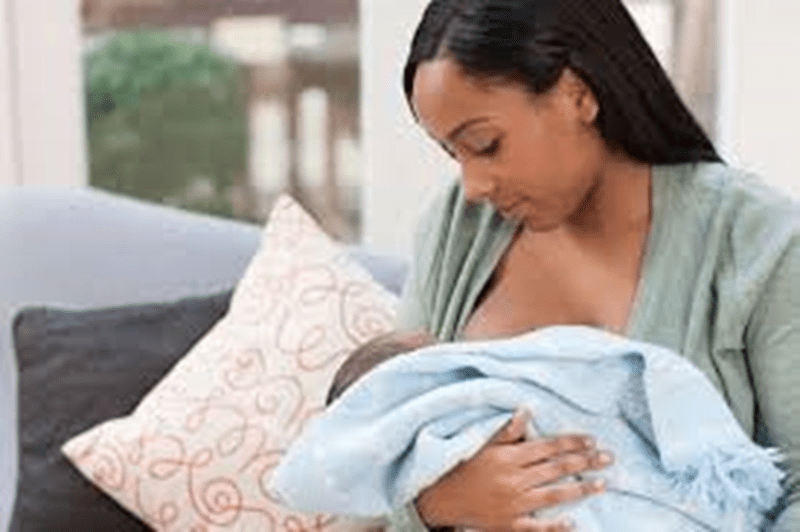 An expectant mother preparing for breastfeeding.