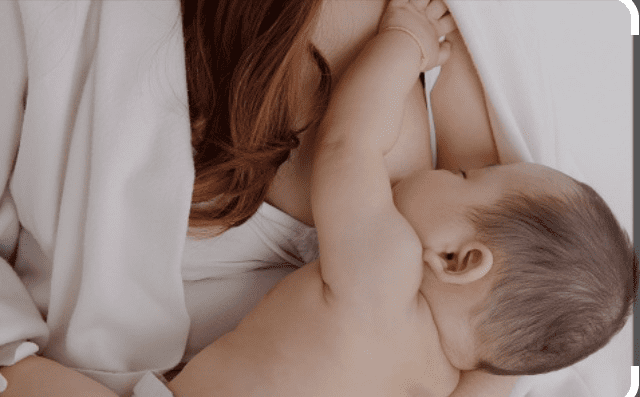 A mother breastfeeding her baby.