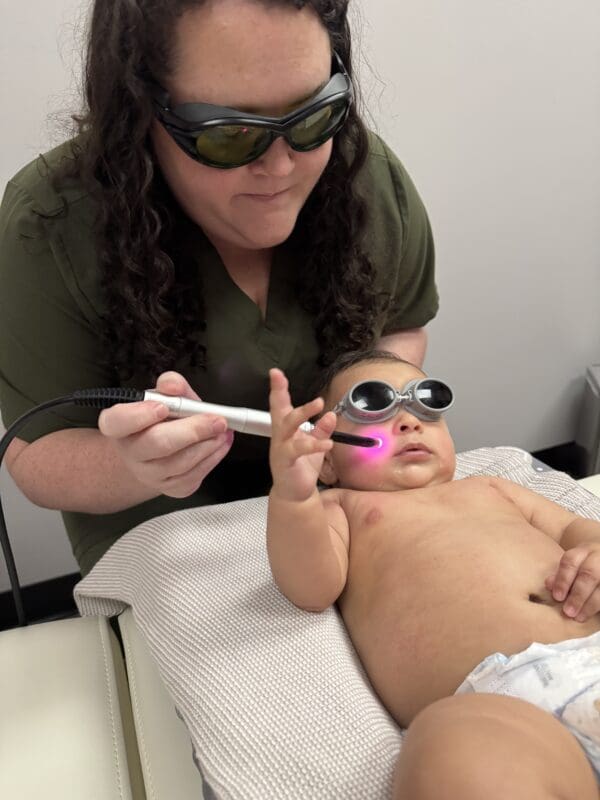 Infant receiving Laser PBM Therapy