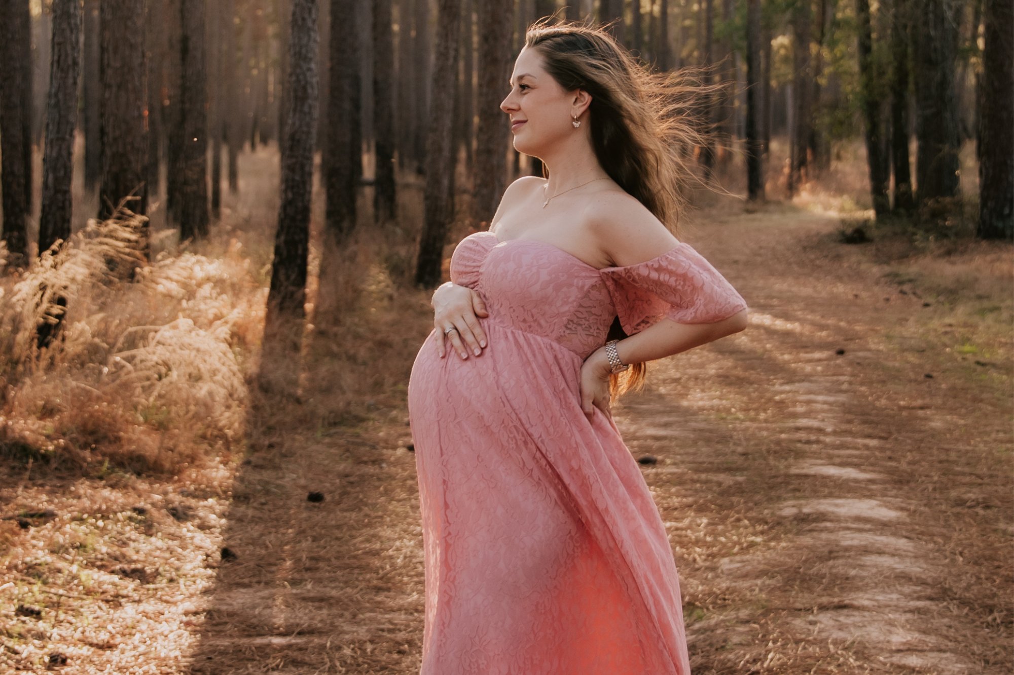 A pregnant parent in the third trimester, preparing for breastfeeding