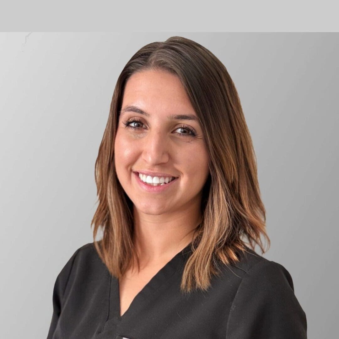 Smiling woman with shoulder-length brown hair. Smiling woman with shoulder-length brown hair.
