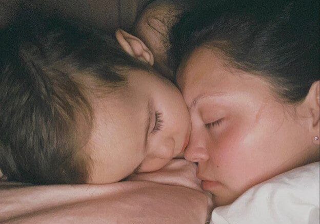 Closeup shot of a woman and a child sleeping image