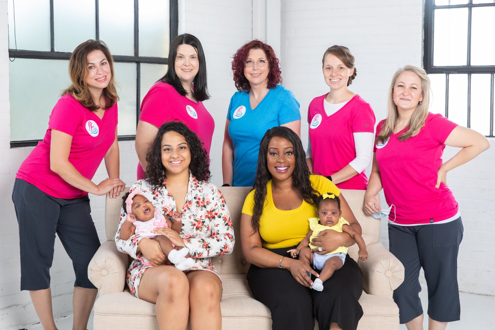 The Bayou City Breastfeeding and Alamo City Breastfeeding IBCLC team with two parents and their babies